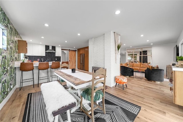 6324 E Colorado St, Long Beach, CA 90803 - dining area featuring a barn door, light wood-style floors, and recessed lighting