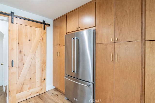 6324 E Colorado St, Long Beach, CA 90803 - kitchen featuring high quality fridge, light wood finished floors, and a barn door