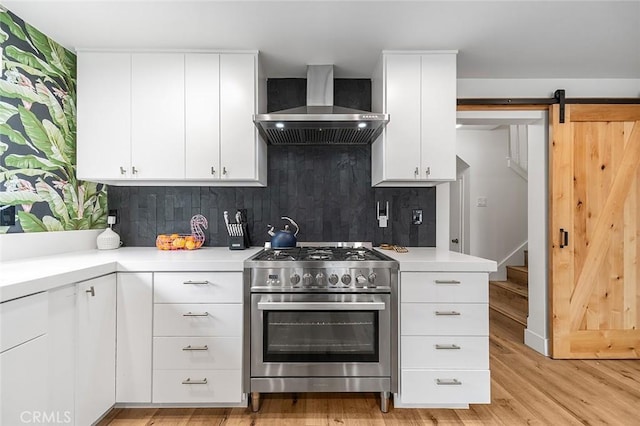 6324 E Colorado St, Long Beach, CA 90803 - kitchen featuring high end stove, wall chimney range hood, light countertops, decorative backsplash, and light wood finished floors