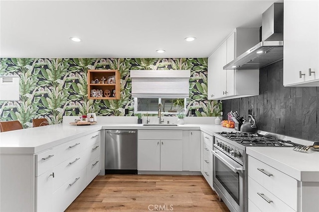 6324 E Colorado St, Long Beach, CA 90803 - kitchen with appliances with stainless steel finishes, a sink, wall chimney exhaust hood, a peninsula, and light countertops