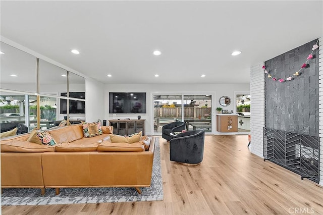 6324 E Colorado St, Long Beach, CA 90803 - living area with light wood finished floors, recessed lighting, and a fireplace