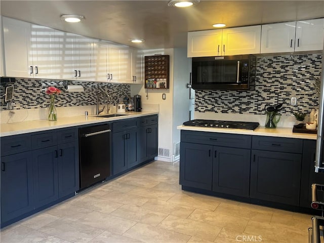 1767 W Chandeleur Dr, San Pedro, CA 90732 - kitchen featuring black appliances, a sink, white cabinets, and tasteful backsplash