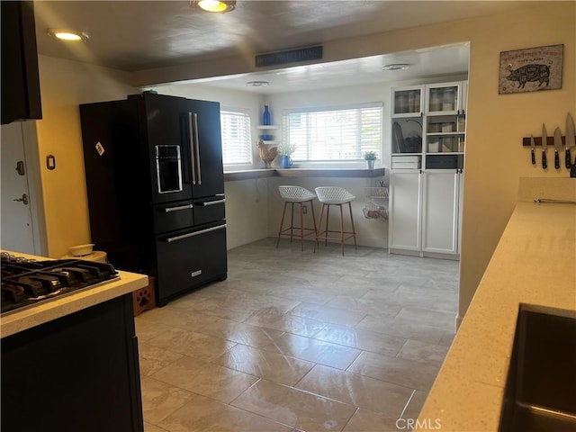 1767 W Chandeleur Dr, San Pedro, CA 90732 - kitchen featuring black fridge and light countertops