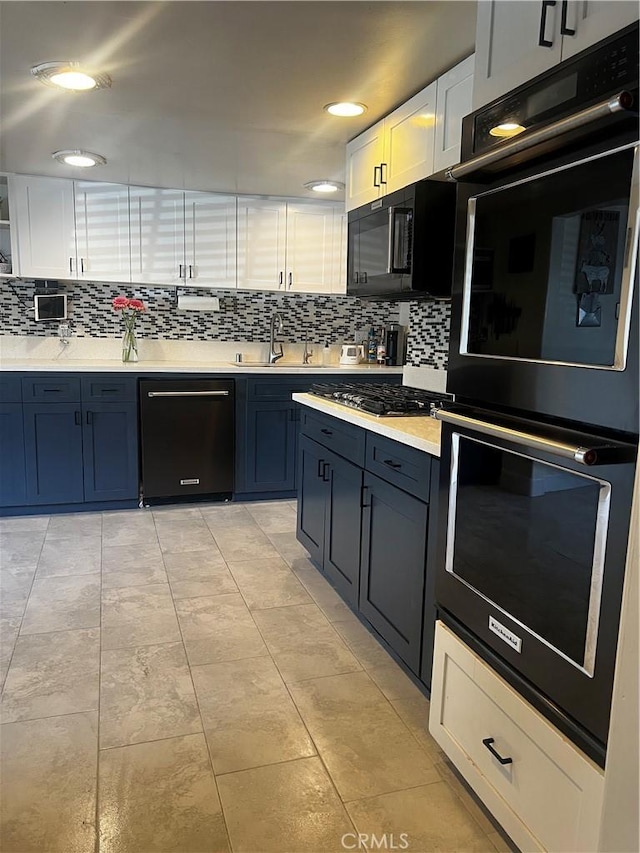 1767 W Chandeleur Dr, San Pedro, CA 90732 - kitchen featuring black appliances, decorative backsplash, a sink, light countertops, and recessed lighting
