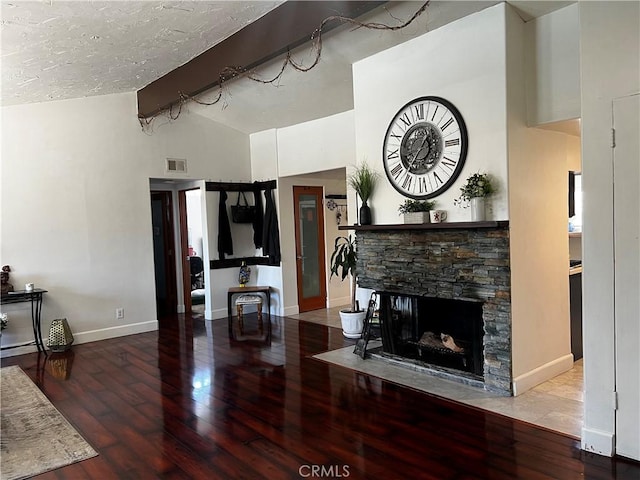 1767 W Chandeleur Dr, San Pedro, CA 90732 - living room with hardwood / wood-style floors, baseboards, a fireplace, and rail lighting