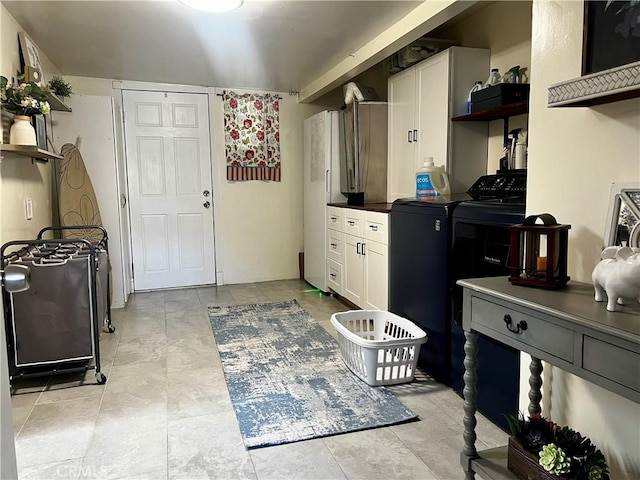 1767 W Chandeleur Dr, San Pedro, CA 90732 - kitchen with open shelves, white cabinets, washing machine and dryer, and dark countertops