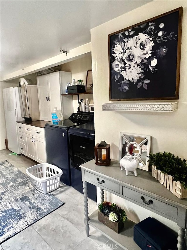 1767 W Chandeleur Dr, San Pedro, CA 90732 - kitchen featuring washer and clothes dryer, white cabinetry, open shelves, dark countertops, and freestanding refrigerator