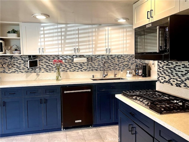 1767 W Chandeleur Dr, San Pedro, CA 90732 - kitchen with black appliances, open shelves, light countertops, and blue cabinets