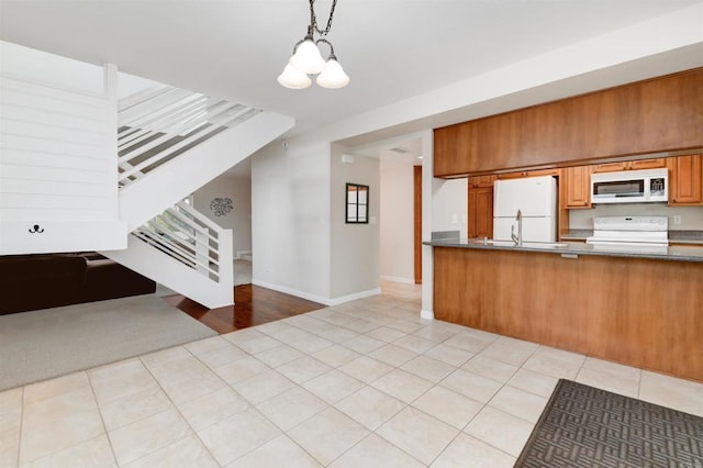 7879 Rancho Fanita Unit A, Santee, CA 92071 - kitchen featuring white appliances, open floor plan, dark countertops, and a chandelier