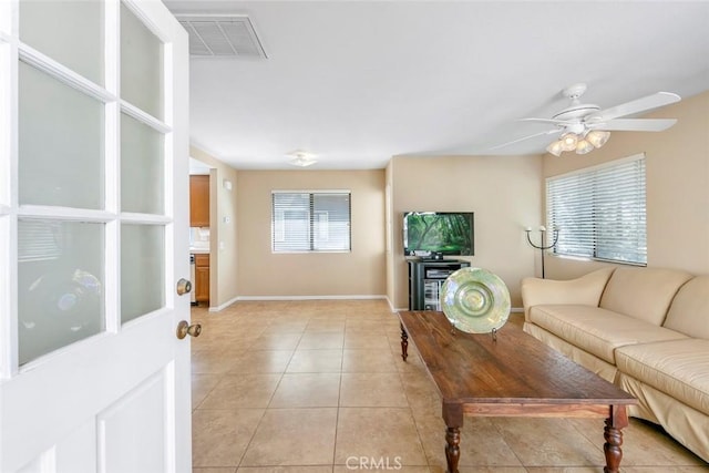 56 Coventry Ln Unit 293, Aliso Viejo, CA 92656 - living area featuring light tile patterned flooring, a ceiling fan, and baseboards