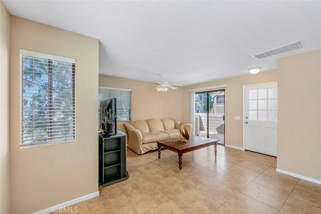 56 Coventry Ln Unit 293, Aliso Viejo, CA 92656 - living room with baseboards, a ceiling fan, and light tile patterned flooring