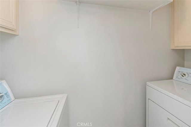 56 Coventry Ln Unit 293, Aliso Viejo, CA 92656 - washroom with cabinet space and washing machine and dryer
