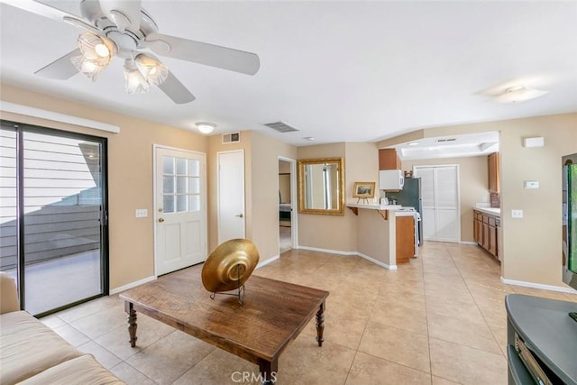 56 Coventry Ln Unit 293, Aliso Viejo, CA 92656 - living room with a ceiling fan, light tile patterned flooring, and baseboards