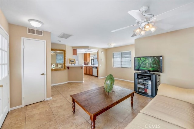 56 Coventry Ln Unit 293, Aliso Viejo, CA 92656 - living room featuring light tile patterned floors, baseboards, and a ceiling fan