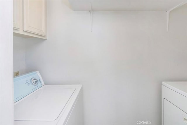 56 Coventry Ln Unit 293, Aliso Viejo, CA 92656 - washroom featuring cabinet space and separate washer and dryer