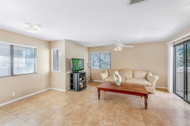 56 Coventry Ln Unit 293, Aliso Viejo, CA 92656 - living area with a ceiling fan, light tile patterned floors, and baseboards