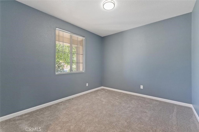 1171 S Filbert Ave, Fresno, CA 93727 - unfurnished room with carpet floors and baseboards