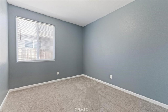1171 S Filbert Ave, Fresno, CA 93727 - carpeted empty room with baseboards