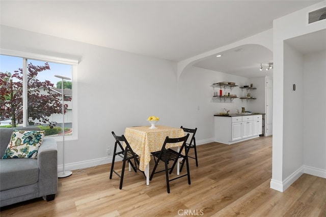 24462 Copper Cliff Ct Unit 20, Lake Forest, CA 92630 - dining area featuring arched walkways, light wood finished floors, and baseboards