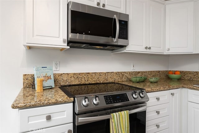 24462 Copper Cliff Ct Unit 20, Lake Forest, CA 92630 - kitchen with stainless steel appliances, white cabinetry, and stone countertops