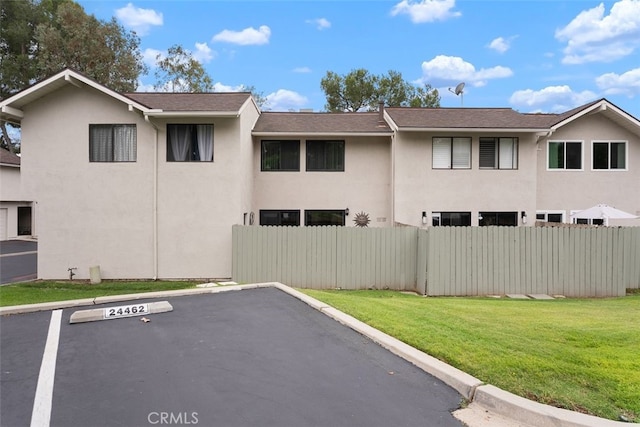 24462 Copper Cliff Ct Unit 20, Lake Forest, CA 92630 - view of side of home featuring stucco siding and uncovered parking