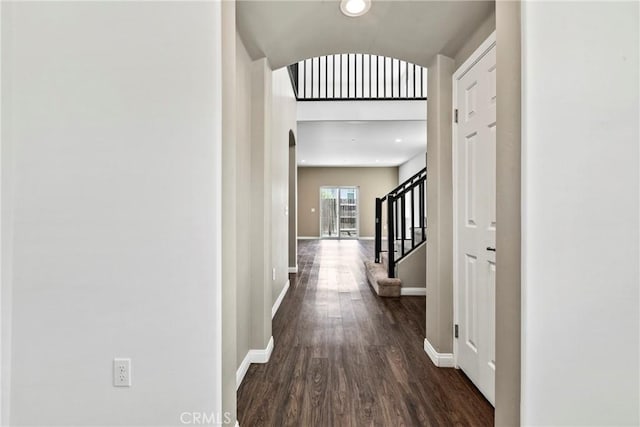 367 Lily Pad Ln, Templeton, CA 93465 - corridor featuring arched walkways, dark wood-style flooring, and stairs