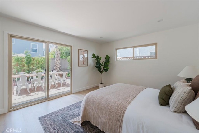 1709 Wollacott St, Redondo Beach, CA 90278 - bedroom featuring access to exterior, light wood-style flooring, multiple windows, and baseboards