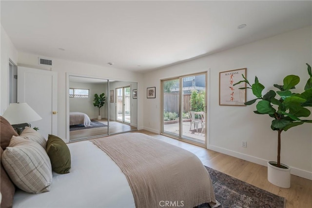 1709 Wollacott St, Redondo Beach, CA 90278 - bedroom with access to exterior, baseboards, wood finished floors, and a closet