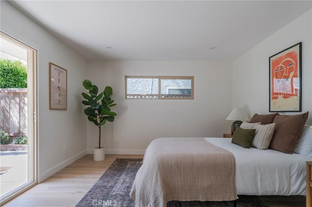 1709 Wollacott St, Redondo Beach, CA 90278 - bedroom with light wood-style floors, access to exterior, and baseboards