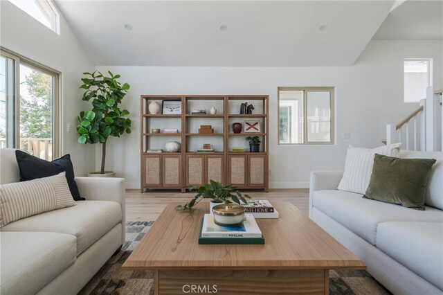 1709 Wollacott St, Redondo Beach, CA 90278 - living area featuring vaulted ceiling, light wood-type flooring, and baseboards