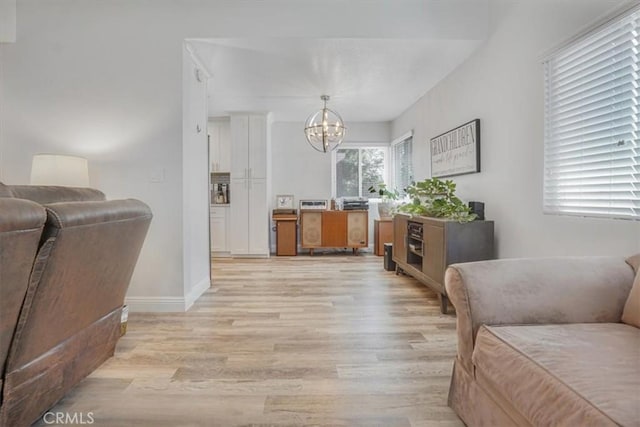 11025 Shaw St, Rancho Cucamonga, CA 91701 - living room featuring light wood finished floors and a chandelier