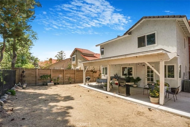 11025 Shaw St, Rancho Cucamonga, CA 91701 - rear view of property featuring stucco siding, a fenced backyard, and a patio