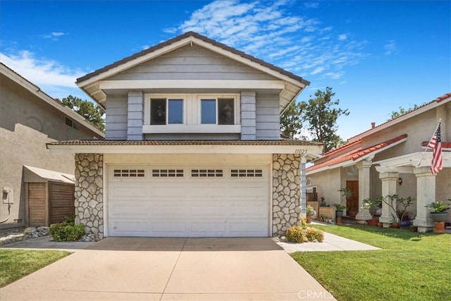11025 Shaw St, Rancho Cucamonga, CA 91701 - view of front of house featuring concrete driveway, stone siding, and a front lawn