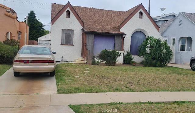 7819 Dalton Ave, Los Angeles, CA 90047 - view of front facade featuring a front lawn, roof with shingles, and stucco siding