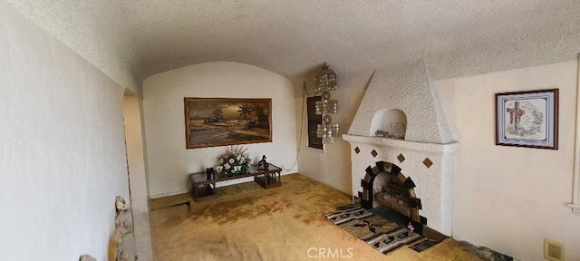 7819 Dalton Ave, Los Angeles, CA 90047 - living area featuring arched walkways, carpet flooring, a textured ceiling, vaulted ceiling, and baseboards