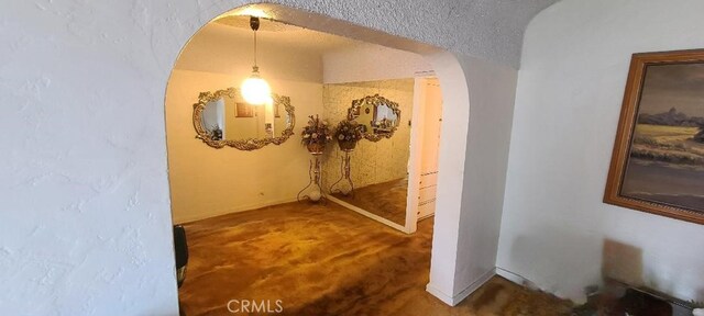 7819 Dalton Ave, Los Angeles, CA 90047 - hallway with carpet, arched walkways, and baseboards