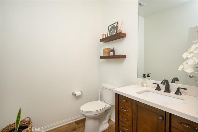 34197 Helenium St, Murrieta, CA 92563 - half bathroom featuring wood finished floors, vanity, toilet, and baseboards