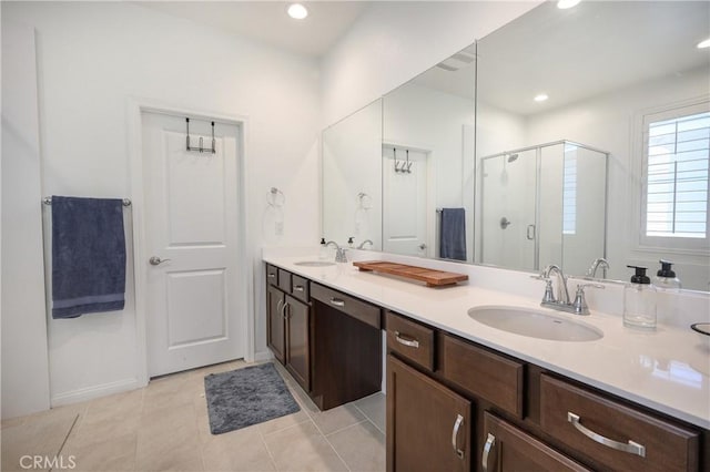 34197 Helenium St, Murrieta, CA 92563 - full bathroom featuring a stall shower, double vanity, recessed lighting, and tile patterned floors