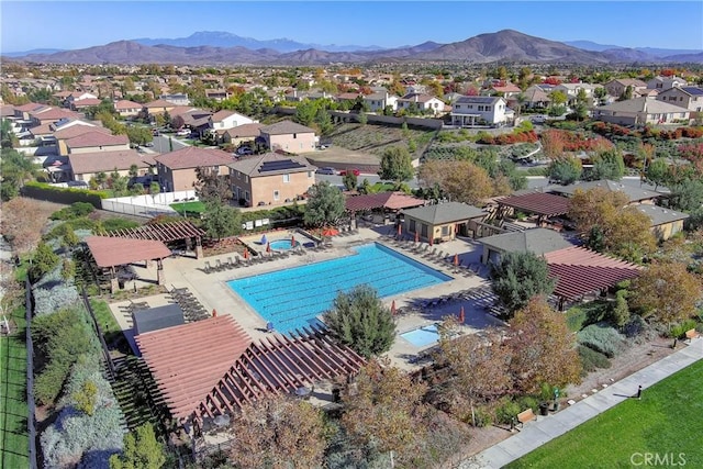 34197 Helenium St, Murrieta, CA 92563 - aerial perspective of suburban area featuring a pool and a mountainous background