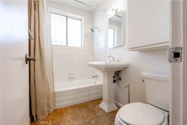 66691 Flora Ave, Desert Hot Springs, CA 92240 - full bath featuring toilet, shower / tub combo with curtain, tile patterned flooring, and baseboards