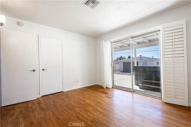 66691 Flora Ave, Desert Hot Springs, CA 92240 - unfurnished room with wood finished floors and baseboards