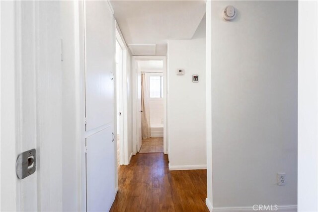 66691 Flora Ave, Desert Hot Springs, CA 92240 - hallway with dark wood-style flooring and baseboards