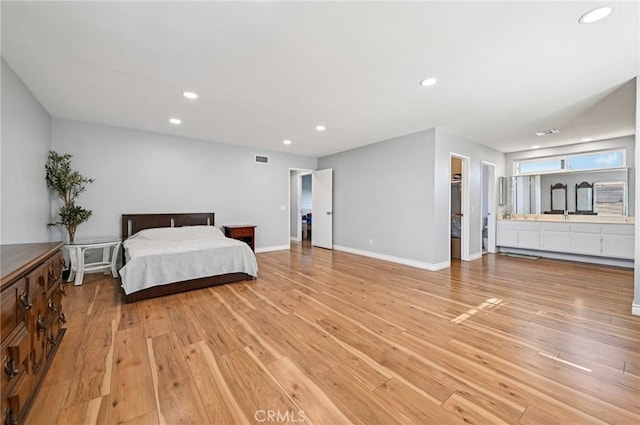 9256 Crocus Ave, Fountain Valley, CA 92708 - bedroom with light wood-type flooring, recessed lighting, and a spacious closet