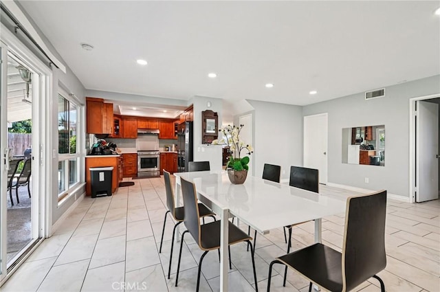 9256 Crocus Ave, Fountain Valley, CA 92708 - dining space with recessed lighting and light marble finish flooring