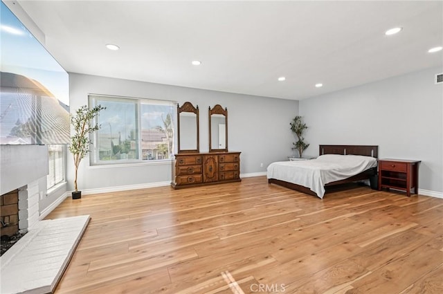 9256 Crocus Ave, Fountain Valley, CA 92708 - bedroom featuring light wood-style floors, a fireplace, and recessed lighting