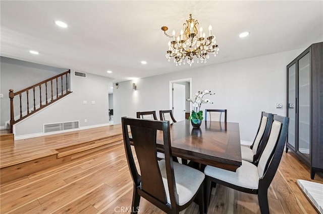 9256 Crocus Ave, Fountain Valley, CA 92708 - dining room featuring stairway, light wood-type flooring, recessed lighting, and a chandelier