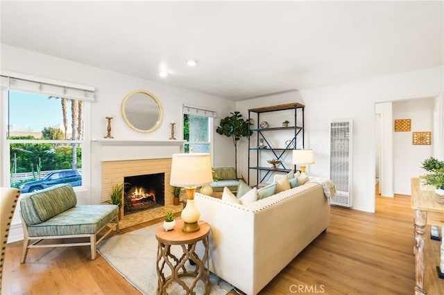 1357 Curtis Ave, Manhattan Beach, CA 90266 - living room with a heating unit, light wood-style flooring, a fireplace, healthy amount of natural light, and recessed lighting
