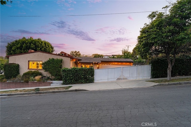 1357 Curtis Ave, Manhattan Beach, CA 90266 - view of front of home with concrete driveway, a garage, a gate, and stucco siding