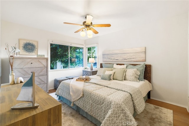1357 Curtis Ave, Manhattan Beach, CA 90266 - bedroom with baseboards, wood finished floors, and ceiling fan