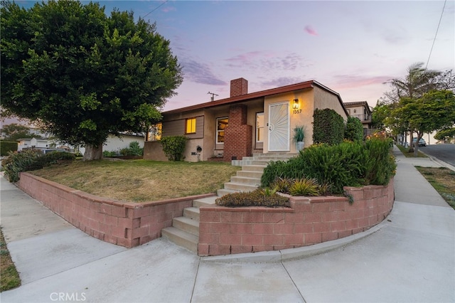 1357 Curtis Ave, Manhattan Beach, CA 90266 - view of front facade featuring a chimney, a front yard, and stucco siding